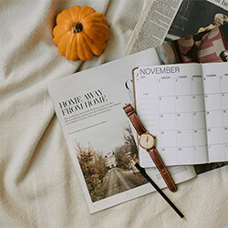 calendar of events with journal and pen